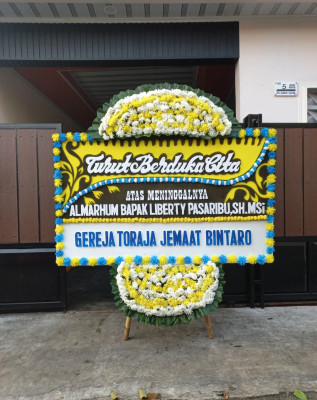 Papan Bunga Duka di Sidoko